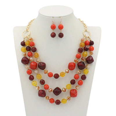 Comercio al por mayor de múltiples capas de plástico aretes collar conjunto de joyas